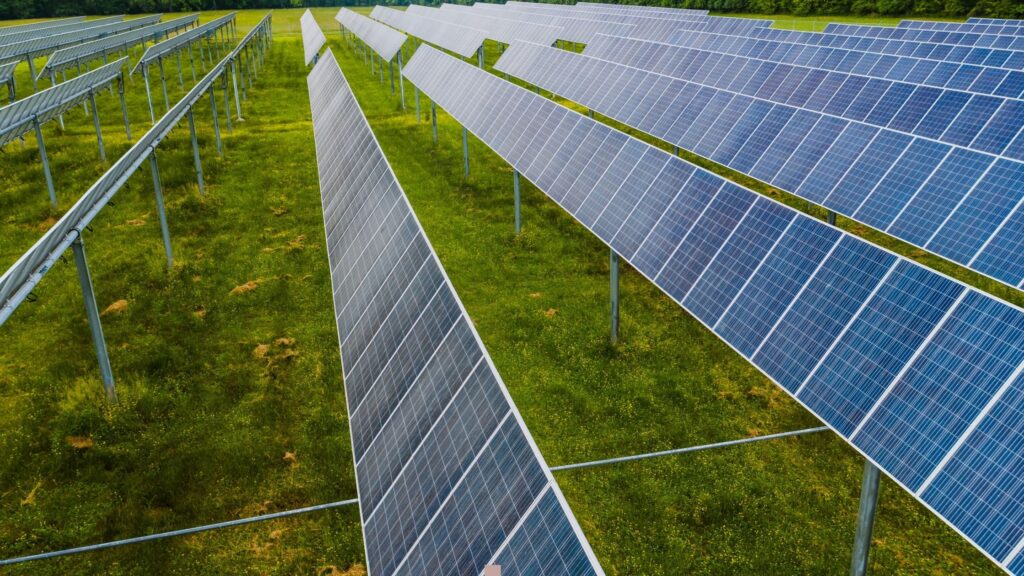 Rows of solar panels installed in open field—CNC machining in precision solar energy equipment and renewable power infrastructure