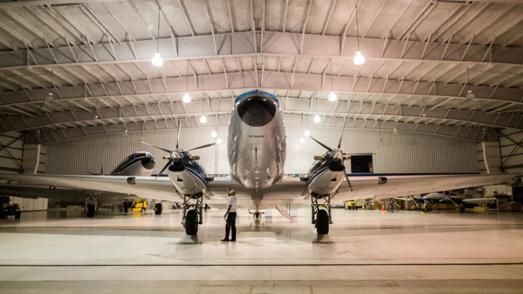Aircraft undergoing inspection in an aerospace facility—demonstrating CNC machining precision parts in aviation manufacturing and maintenance