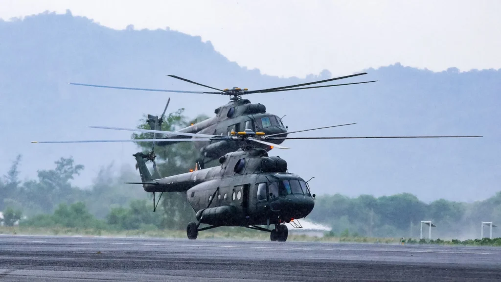 Military helicopters on airstrip—highlighting CNC machining in defense aerospace manufacturing and precision rotary aircraft components